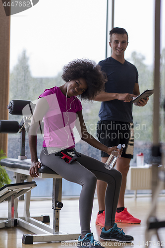 Image of couple in a gym have break