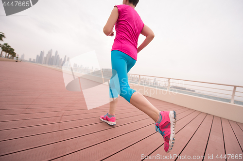 Image of woman running on the promenade