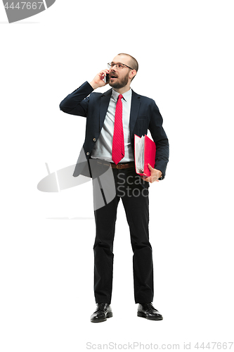 Image of Happy businessman talking on the phone with folder in hand isolated over white background in studio shooting