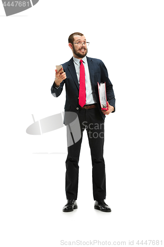 Image of Happy businessman talking on the phone with folder in hand isolated over white background in studio shooting