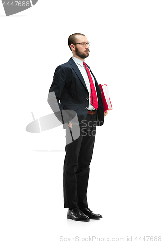 Image of Full body portrait of businessman with folder on white