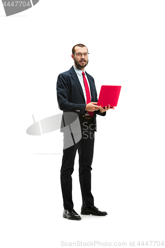 Image of Picture of handsome young bearded man standing over white studio background with laptop