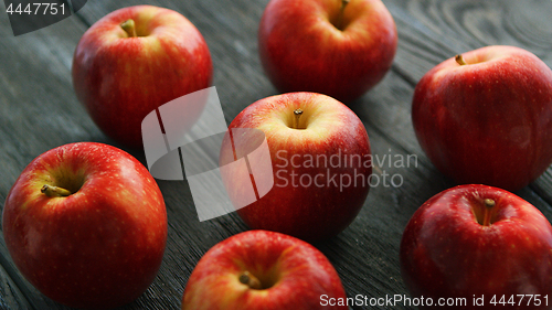 Image of Ripe apples on wooden table 