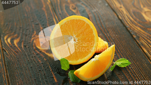 Image of Ripe cut orange on table 