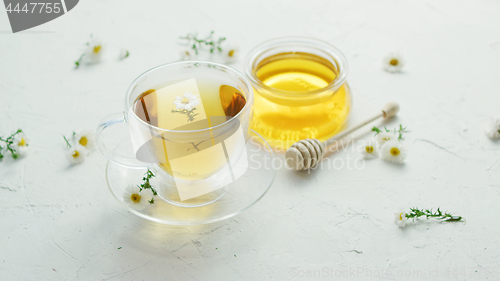Image of Herbal tea and jar of honey