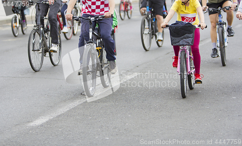 Image of Bicyclists in traffic on the streets of the city