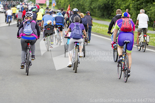 Image of Bicyclists in traffic on the streets of the city