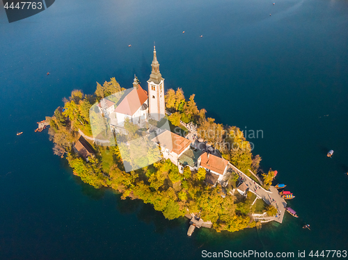 Image of Aerial view of Bled island on lake Bled, and Bled castle and mountains in background, Slovenia.