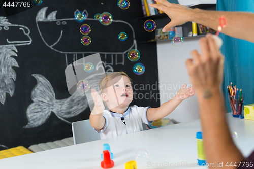 Image of Cute little toddler boy at child therapy session.