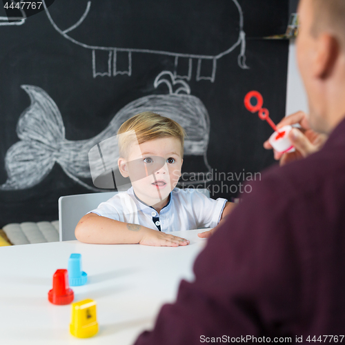 Image of Cute little toddler boy at child therapy session.