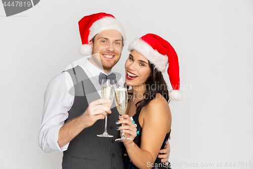 Image of couple with champagne glasses at christmas party