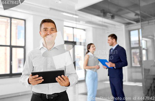 Image of realtor with tablet pc and customers at office