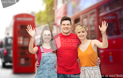 Image of happy friends over london city street background