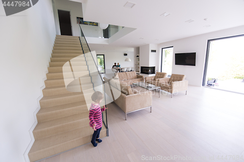 Image of family with little girl enjoys in the modern living room