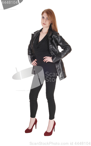 Image of Woman standing in leather jacket