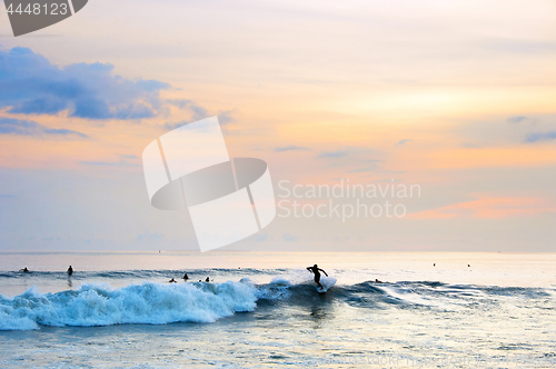 Image of Surfing on Bali at sunset