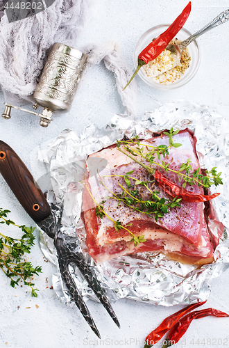 Image of raw meat in foil