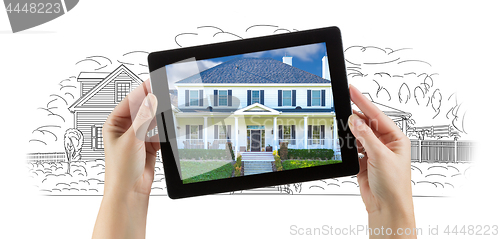 Image of Female Hands Holding Computer Tablet with House Photo on Screen 