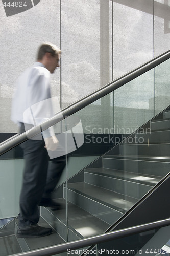 Image of Businessman ascending stairs