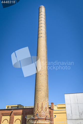 Image of Tall chimney made of bricks on a factory