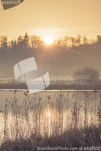 Image of Lake scenery in the morning sunshine with mist