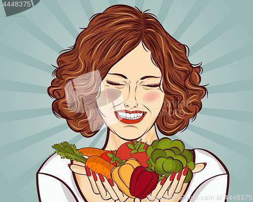 Image of beautiful red-haired lady with vegetables in his hands