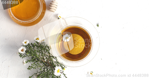 Image of Cup of tea and bowl of honey