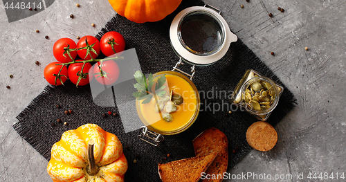 Image of Pumpkin soup with bread and vegetables 