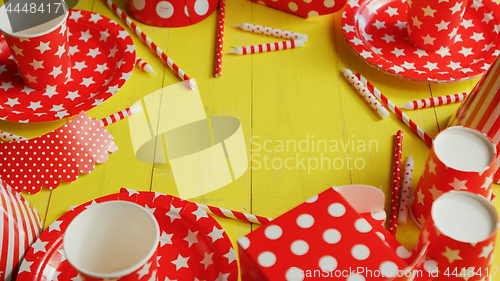 Image of Festive paper plates and cups laid in circle