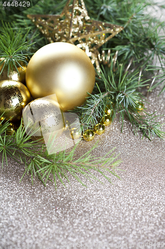 Image of Christmas decorations and evergreen fir tree branch.