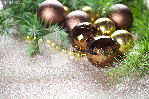 Image of Christmas decorations and evergreen fir tree branch.