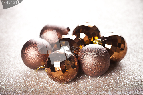 Image of Christmas golden and brown decorations.