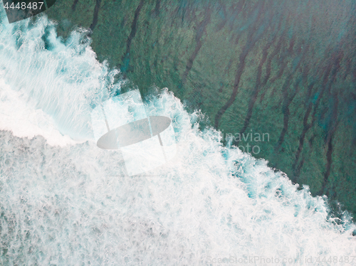 Image of Aerial shot of the braking wave in the ocean.