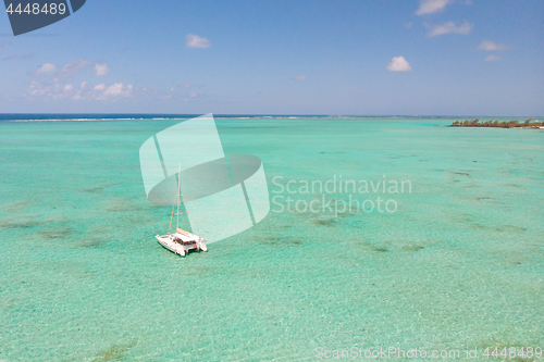 Image of Aerial view of Catamaran boat sailing in turquoise lagoon of Ile aux Cerfs Island lagoon in Mauritius.