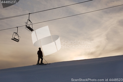 Image of Skier silhouette against glowing sky