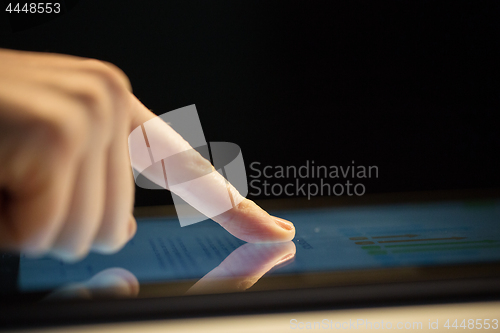 Image of close up of hand using computer touch screen