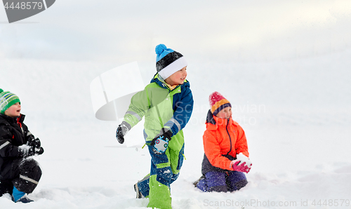 Image of happy little kids playing outdoors in winter