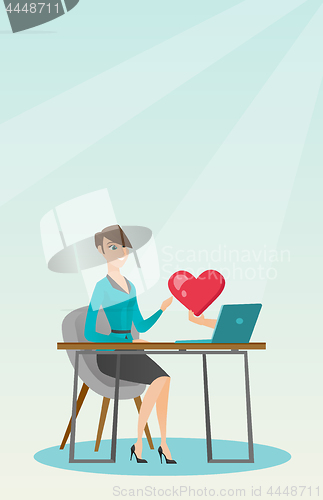 Image of Young woman using a laptop online dating.