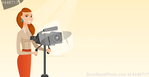 Image of Cameraman with movie camera on tripod.