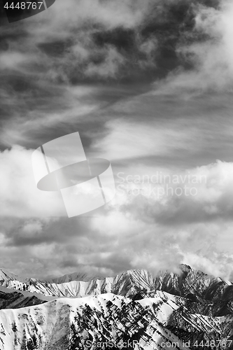 Image of Black and white winter snow mountains and cloudy sky