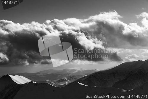 Image of Black and white view on winter mountains in evening and sunlight