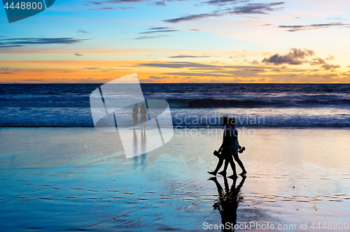 Image of Romantic couple walk  beach Bali