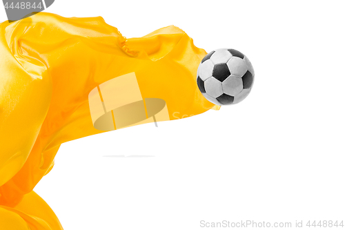 Image of Soccer ball and Smooth elegant transparent yellow cloth isolated or separated on white studio background.