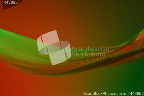 Image of Smooth elegant transparent green cloth on green colored background.