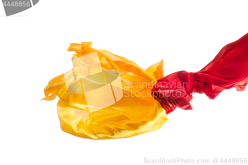 Image of Smooth elegant transparent yellow, red, cloth separated on white background.