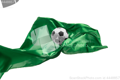 Image of Soccer ball and Smooth elegant transparent green cloth isolated or separated on white studio background.