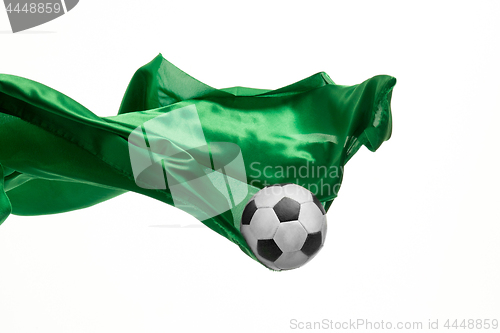 Image of Soccer ball and Smooth elegant transparent green cloth isolated or separated on white studio background.