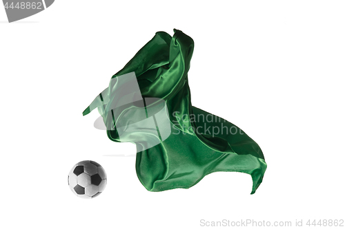 Image of Soccer ball and Smooth elegant transparent green cloth isolated or separated on white studio background.