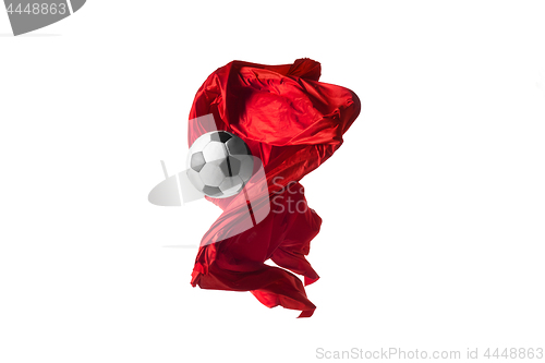 Image of Soccer ball and Smooth elegant transparent red cloth isolated or separated on white studio background.