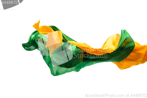Image of Smooth elegant transparent yellow, green cloth separated on white background.